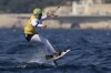 Valentin Bontus of Austria celebrates after the men's kite semifinal race during the 2024 Summer Olympics, Thursday, Aug. 8, 2024, in Marseille, France. (AP Photo/Carolyn Kaster)