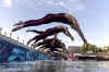 Competitors dive into the Seine river for the start of the marathon swimming men's 10km, at the 2024 Summer Olympics, Friday, Aug. 9, 2024, in Paris, France. (AP Photo/David Goldman, Pool)