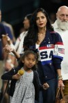 Vanessa and Capri Bryant walks to their seats at the USA vs' Australia match-up during a women's semifinal basketball game at Bercy Arena at the 2024 Summer Olympics, Friday, Aug. 9, 2024, in Paris, France. (AP Photo/Mark J. Terrill)