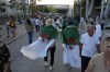 Fans of Algeria arrive ahead of Algeria's Imane Khelif fight against China's Yang Liu in their women's 66 kg final boxing match at the 2024 Summer Olympics, Friday, Aug. 9, 2024, in Paris, France. (AP Photo/John Locher)