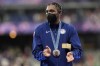 Men's 200-meter bronze medalist, Noah Lyles, of the United States, applauds while standing on the podium at the 2024 Summer Olympics, Friday, Aug. 9, 2024, in Saint-Denis, France. (AP Photo/Bernat Armangue)