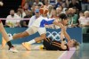 Janelle Salaun (13), of France, falls as Julie Vanloo (35), of Belgium, passes during a floor scramble during a women's semifinal basketball game at Bercy Arena at the 2024 Summer Olympics, Friday, Aug. 9, 2024, in Paris, France. (AP Photo/Mark J. Terrill)