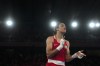 Algeria's Imane Khelif celebrates after defeating China's Yang Liu to win gold in their women's 66 kg final boxing match at the 2024 Summer Olympics, Friday, Aug. 9, 2024, in Paris, France. (AP Photo/Ariana Cubillos)