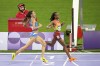 Beatrice Chebet, of Kenya, crosses the finish line followed by Nadia Battocletti, of Italy, during the women's 10,000-meter final at the 2024 Summer Olympics, Friday, Aug. 9, 2024, in Saint-Denis, France. (AP Photo/Natacha Pisarenko)