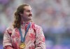 Ethan Katzberg, of Nanaimo, B.C., receives his gold medal in the men's hammer throw event at the 2024 Summer Olympics, Monday, Aug. 5, 2024, in Saint-Denis, France. THE CANADIAN PRESS/Christinne Muschi