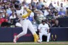 Milwaukee Brewers' Willy Adames hits an RBI-single during the sixth inning of a baseball game against the Cincinnati Reds, Sunday, Aug. 11, 2024, in Milwaukee. (AP Photo/Aaron Gash)