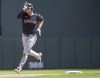 Cleveland Guardians' David Fry (6) shows his stuff as he rounds second after nailing a solo home run in the top of the sixth inning of a baseball game against the Minnesota Twins in Minneapolis, Minn., Sunday, Aug. 11, 2024. (Elizabeth Flores/Star Tribune via AP)