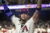 Arizona Diamondbacks' Ketel Marte acknowledges fans as he celebrates after his solo-home run against the Philadelphia Phillies during the first inning of a baseball game Saturday, Aug 10, 2024, in Phoenix. (AP Photo/Darryl Webb)