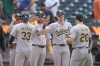 Oakland Athletics' JJ Bleday (33) and Zack Gelof (20) celebrate with teammates after a baseball game against the New York Mets, Thursday, Aug. 15, 2024, in New York. The Athletics won 7-6. (AP Photo/Frank Franklin II)
