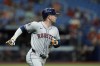 Houston Astros' Alex Bregman watches his home run off Tampa Bay Rays starting pitcher Shane Baz during the fifth inning of a baseball game Tuesday, Aug. 13, 2024, in St. Petersburg, Fla. (AP Photo/Chris O'Meara)
