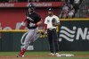 Minnesota Twins' Ryan Jeffers (27) runs the base past Texas Rangers second base Marcus Semien (2) after Jeffers hit a home run during the third inning of a baseball game in Arlington, Texas, Friday, Aug. 16, 2024. (AP Photo/LM Otero)