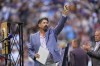 Retired Colorado Rockies first baseman and Major League Baseball Hall of Famer Todd Helton waves to the crowd during a ceremony to mark his induction into the Hall last month before a baseball game, Saturday, Aug. 17, 2024, in Denver. (AP Photo/David Zalubowski)