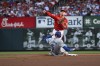 Los Angeles Dodgers' Freddie Freeman (5) is out at second as St. Louis Cardinals second baseman Nolan Gorman, top, throws to first on a double play-attempt against Will Smith during the firsts inning of a baseball game Saturday, Aug. 17, 2024, in St. Louis. (AP Photo/Jeff Le)
