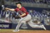 Arizona Diamondbacks relief pitcher Paul Sewald (38) throws during the ninth inning of a baseball game against the Miami Marlins, Monday, Aug. 19, 2024, in Miami. (AP Photo/Lynne Sladky)