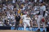 San Diego Padres' David Peralta (24) celebrates after hitting an RBI single during the second inning of a baseball game against the Minnesota Twins, Tuesday, Aug. 20, 2024, in San Diego. (AP Photo/Gregory Bull)