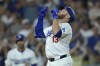 Los Angeles Dodgers' Max Muncy crosses the plate after hitting a solo home run in the fourth inning of a baseball game against the Seattle Mariners, Tuesday, Aug. 20, 2024, in Los Angeles. (AP Photo/Jayne-Kamin-Oncea)