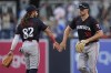Minnesota Twins right fielder Matt Wallner, right, celebrates with teammate center fielder Austin Martin after the Twins defeated the San Diego Padres 11-4 in a baseball game Wednesday, Aug. 21, 2024, in San Diego. (AP Photo/Gregory Bull)