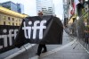 Dystopian themes and real-world issues will take centre stage in the Canadian titles at this year's Toronto International Film Festival. The red carpet of the TIFF Tribute Awards gala fundraiser is torn down by stagehands, during the Toronto International Film Festival, in Toronto, Sunday, Sept. 10, 2023. THE CANADIAN PRESS/Christopher Katsarov