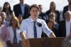 Prime Minister Justin Trudeau speaks to reporters as cabinet members look on during the Liberal cabinet retreat in Charlottetown, P.E.I. on Wednesday, August 23, 2023. THE CANADIAN PRESS/Darren Calabrese