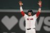 Boston Red Sox's Danny Jansen celebrates after hitting an RBI single during the eighth inning of a baseball game against the Texas Rangers at Fenway Park, Wednesday, Aug. 14, 2024, in Boston. (AP Photo/Charles Krupa)