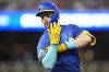 Minnesota Twins' Ryan Jeffers gestures after hitting a single during the third inning of a baseball game against the St. Louis Cardinals, Friday, Aug. 23, 2024, in Minneapolis. (AP Photo/Abbie Parr)