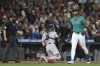 Seattle Mariners' Julio Rodríguez, right, is called out on strikes by umpire Tripp Gibson, left, as San Francisco Giants catcher Curt Casali looks on during the ninth inning of a baseball game, Saturday, Aug. 24, 2024, in Seattle. (AP Photo/Jason Redmond)