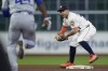 Houston Astros second baseman Jose Altuve, right, forces out Kansas City Royals' Dairon Blanco, left, before turning an unassisted double play on Bobby Witt Jr. during the eighth inning of a baseball game Thursday, Aug. 29, 2024, in Houston. (AP Photo/Kevin M. Cox)