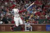 St. Louis Cardinals' Tommy Pham watches his sacrifice fly to score Nolan Arenado during the fourth inning of a baseball game against the Milwaukee Brewers Wednesday, Aug. 21, 2024, in St. Louis. (AP Photo/Jeff Roberson)
