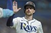 Tampa Bay Rays' Brandon Lowe celebrates after scoring on an RBI double by Junior Caminero off Minnesota Twins starting pitcher Simeon Woods Richardson during the third inning of a baseball game Monday, Sept. 2, 2024, in St. Petersburg, Fla. (AP Photo/Chris O'Meara)