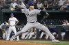 New York Yankees relief pitcher Clay Holmes pitches against the Texas Rangers during the ninth inning of a baseball game Tuesday, Sept. 3, 2024, in Arlington, Texas. (AP Photo/Jeffrey McWhorter)