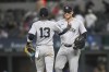 New York Yankees Anthony Rizzo, right, and teammate Jazz Chisholm Jr., left, celebrate after a baseball game against the Texas Rangers, Monday, Sept. 2, 2024, in Arlington, Texas. (AP Photo/Albert Pena)