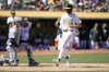 Oakland Athletics' Zack Gelof (20) scores a run past Detroit Tigers catcher Dillon Dingler, left, on a single by Kyle McCann during the fifth inning of a baseball game Saturday, Sept. 7, 2024, in Oakland, Calif. (AP Photo/Tony Avelar)