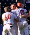 TOM HANSON / THE CANADIAN PRESS FILES
                                Team Canada&rsquo;s Lee Delfino from Pickering, Ont. (centre) celebrates with teammates Aaron Guiel (left) of Langley, B.C. and Julien Lepine (right) of Charlesbourg, Que. after Lepine scored the winning run in the bottom of the 11th inning against the United States during Pan American Games baseball action in Winnipeg Monday July 26, 1999. Canada won 7-6.