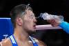 John Locher / The Associated Press
                                Kazakhstan&rsquo;s Aibek Oralbay is sprayed with water between rounds against Nigeria&rsquo;s Olaitan Olaore during men&rsquo;s 92-kg preliminary round boxing Sunday in Paris.