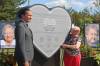 Manitoba Premier Wab Kinew and Josephine (Jo) Stokoteiny, one of the survivors of the collision near Carberry between a semi-truck and a bus full of seniors, pose for a picture with a monument unveiled in Carberry on Sunday afternoon to honour the crash victims, survivors and the first responders who attended the scene. (Abiola Odutola/The Brandon Sun)