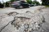 MIKAELA MACKENZIE / FREE PRESS
                                A pothole on Westminster Avenue.