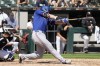 Texas Rangers' Corey Seager hits a solo home run during the fourth inning of a baseball game against the Chicago White Sox in Chicago, Thursday, Aug. 29, 2024. (AP Photo/Nam Y. Huh)