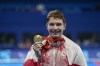 Canada's Nicholas Bennett poses with his gold medal after winning the men's 200 m. Individual medley SM14 at the 2024 Paralympics, Wednesday, Sept. 4, 2024, in Paris, France. THE CANADIAN PRESS/AP-Aurelien Morissard