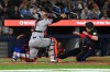 Toronto Blue Jays' Brian Serven, right, slides into home ahead of a tag by New York Mets catcher Francisco Alvarez (4) in the seventh inning during MLB baseball action in Toronto on Monday Sept. 9, 2024. THE CANADIAN PRESS/Jon Blacker