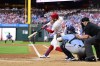 Philadelphia Phillies' Kyle Schwarber, center, hits a solo home run off Tampa Bay Rays' Taj Bradley during the first inning of a baseball game, Tuesday, Sept. 10, 2024, in Philadelphia. (AP Photo/Derik Hamilton)