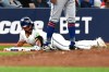 Toronto Blue Jays second baseman Davis Schneider (36) slides safely into third base with a triple against the New York Mets during fourth inning MLB baseball action in Toronto on Tuesday Sept. 10, 2024. THE CANADIAN PRESS/Jon Blacker