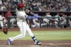 Arizona Diamondbacks' Ketel Marte connects for a three-run home run against the Texas Rangers during the fourth inning of a baseball game Wednesday, Sept. 11, 2024, in Phoenix. (AP Photo/Ross D. Franklin)