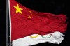 FILE - The Chinese and the Olympic flag wave during the opening ceremony of the 2022 Winter Olympics, Feb. 4, 2022, in Beijing. (AP Photo/Petr David Josek, File)