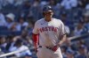 Boston Red Sox's Rafael Devers smiles after hitting a two-run single during the fifth inning of a baseball game against the New York Yankees, Saturday, Sept. 14, 2024, in New York. (AP Photo/Frank Franklin II)