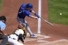 Kansas City Royals' Bobby Witt Jr. (7) hits a sacrifice fly off Pittsburgh Pirates starting pitcher Mitch Keller, scoring Maikel Garcia from third, during the fifth inning of a baseball game in Pittsburgh, Saturday, Sept. 14, 2024. (AP Photo/Gene J. Puskar)