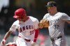 Chicago White Sox first baseman Gavin Sheets (32) tags out Los Angeles Angels' Jordyn Adams (39) at first base during the third inning of a baseball game in Anaheim, Calif., Wednesday, Sept. 18, 2024. (AP Photo/Ashley Landis)