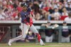 Atlanta Braves' Orlando Arcia hits a ground ball against the Cincinnati Reds during the third inning of a baseball game, Wednesday, Sept. 18, 2024, in Cincinnati. (AP Photo/Jay LaPrete)