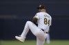 San Diego Padres starting pitcher Dylan Cease works against a Houston Astros batter during the first inning of a baseball game Wednesday, Sept. 18, 2024, in San Diego. (AP Photo/Gregory Bull)