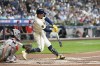 Milwaukee Brewers' Rhys Hoskins hits a home run during the fifth inning of a baseball game against the Philadelphia Phillies Wednesday, Sept. 18, 2024, in Milwaukee. (AP Photo/Morry Gash)