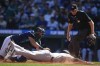 Seattle Mariners catcher Cal Raleigh tags New York Yankees' Jasson Domínguez out at home on a single by Anthony Volpe during the second inning of a baseball game Thursday, Sept. 19, 2024, in Seattle. (AP Photo/Lindsey Wasson)
